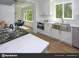 remodeled kitchen white cabinets marble