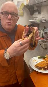 The making of the Ruben fresser. Using our homemade seeded Deli Rye,  Russian dressing , corn beef, Swiss cheese, what makes our special we add  pastrami, bake it in a little bit of butter to a melting ...