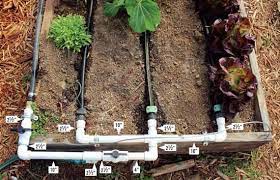 For many people the irrigation system consists of hoses, splitters, sprinklers, and maybe a timer. How To Build A Simple Raised Bed Garden Watering System Irrigation System Diy Garden Irrigation System