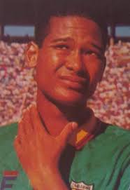 HENRY MOTEGO. Henry Motego (Kenya Breweries) steers the ball away as Gor  Mahia's Zedekiah "Zico" Otieno gives chase. Goalkeeper Joseph Kibera looks  on.