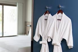 Download Premium Photo Beautiful Mom Dries Hair With A Hairdryer To Her Little Happy Son Dressed In A White Bathrobe