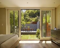 Large sliding steel doors obscure the boundary brining the outdoors inside and allowing guests to flow freely from interior living barn doors and hardware handcrafted in washington | realcraft. Bedroom Sliding Glass Doors Patio French Doors Patio Glass Doors Patio