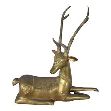 Classic log interior with touch of stone (photo credit: Vintage Sarreid Brass Deer Figurine Chairish