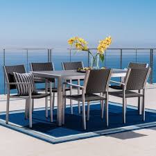 These dining sets are crafted from a durable and lightweight material, so it's easy to move or adjust aluminum patio dining sets and refresh the appearance of your outdoor space. Cape Coral 7pc Aluminum Wicker Glass Outdoor Patio Dining Set Silver Gray Christopher Knight Home Target