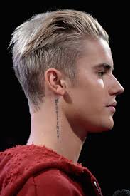 The 'sorry' singer has had a small cross done just under his eye, and his tattoo artist has explained the meaning: 24 Of Justin Bieber S Tattoos Explained In Slightly Creepy Detail
