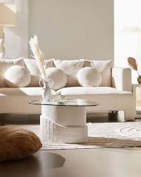 Visual interest is abundant in this small living room interior, from the golden leather ottomans to the glass and driftwood coffee table. 30 Living Room Decorating Ideas Decor Inspiration 2020
