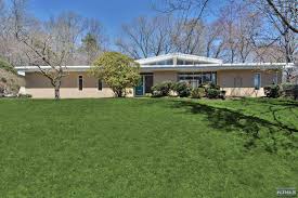 This wide open floor plan has polished concrete floors, over height 10'8 foot ceilings and floor to ceiling south facing win. Mid Century Modern Homes With Magnificent Style