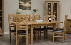 Elio extending round table with circular top that becomes oval when extended. Canterbury Oak Extending Oval Dining Table Only Oak