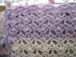 A crochet version is also available. Lacy Open Shell Crochet Afghan Pattern Favecrafts Com