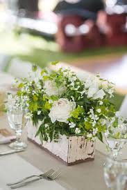 White centerpiece floral centerpieces wedding centerpieces wedding table wedding bouquets wedding flowers green wedding low full centerpiece with blue hydrangeas, white peonies and roses accented with bachelor buttons (cornflowers) and green viburnum in cube or cylinder. Rustic White And Green Centerpieces Green Centerpieces Green White Decor Rustic Wedding Flowers