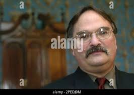 Rhode Island Historical Society executive director Bernard Fishman stands  in front of a "nine-shell" block-front desk commissioned by Providence  merchant Joseph Brown in the late 18th century, Thursday, Feb. 10, 2005, at  the John Brown House in ...