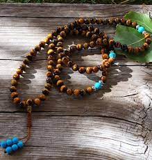 Blue tiger eye is embodiment of strength, will power and courage. Tigers Eye Turquoise Mala