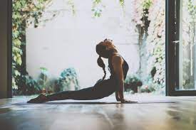 Jana defi posing by the window. Yoga Poses Cobra Pose Bhujangasana Tips Benefits And Follow Up Poses Z Living