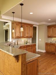 The kitchen area and the dining area is divided with the bar table. Stunning Furniture Marvellous Kitchen Paint Colors Brown Cabinets 50