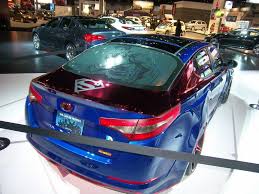 The Superman Themed Optima Hybrid Is The Sixth Of Eight Customized Kia Vehicles Representing Characters From The Justice League To B Kia Optima Kia Custom Cars