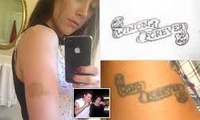 He got it when he was madly in love with actress winona ryder. Johnny Depp Is Accused Of Slapping Amber Heard For Laughing At His Infamous Wino Forever Tattoo Daily Mail Online