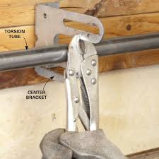 How To Repair Garage Door Springs And Cables Overhead Garage Door Garage Door Springs Garage Door Spring Repair