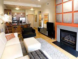 Points of interest ● window wall with ocean view ● turquoise beaded chandelier over long wood dining table ● palisade twin motor ceiling fan ● gray sideboard with hexagon accent on cabinet. Decorate A Long Narrow Room Ideas Tips Tricks Lovetoknow