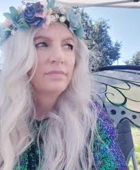 Painted kids' faces at a local farm's fairy day