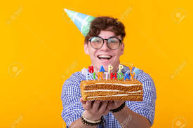 Birthdays are a fun time to share not just beautiful, motivational wishes, but also hilarious ones funny happy birthday wishes for a boy. Funny Positive Guy Holds In His Hands A Homemade Cake With The Stock Photo Picture And Royalty Free Image Image 129561682