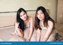 Young Asian Lesbian Women Couple on Bed Stock Photo - Image of love,  bedroom: 108722588
