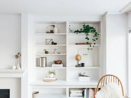 Modern shelves in exposure to private wood in the living room wall. How To Decorate Your Home With An Empty Wall