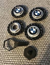 It was suggested a center cap from a e12 5 series might work. Bmw E30 Bbs Wheel Center Cap 09 23 113 09 24 038 Set Of 4 Black Silver W Tools Ebay Bmw E30 E30 Bmw