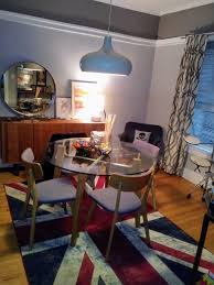 Dining Music Room Union Jack Rug Under Cb2 Glass Dining Table In 2020 Glass Dining Table Dining Table Union Jack Rug