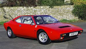 It is a rosso red 2 door 2 +2 coupe with black. 1974 Ferrari Dino Specs How Car Specs