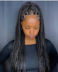 The hairstyle is pretty dense. Top African Hairstyles On Instagram Stunning Hairbybrazy Boxbraids Knotlessbraids Girls Hairstyles Braids African Hairstyles Braided Hairstyles