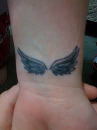 Some of their general meanings are spirituality, enlightenment, guidance. Black Ink Small Angel Wings Tattoo On Wrist