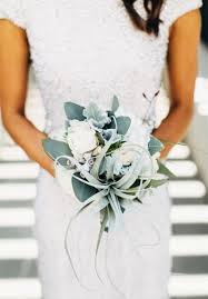 Holiday bouquet consumes most of the fresh cut holiday flowers. Minimal Bridal Bouquet Arabia Weddings