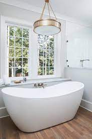 It is, therefore, better if the tub is placed in the middle of the bathroom. Chandelier Over Tub Design Ideas
