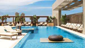 Hotel Staff Sets Rolled White Towel On Lounge Chair By Sunny Outdoor Swimming Pool Hotel Pool Four Seasons Hotel Luxury Hotel