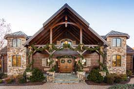 The residence overlooks a mountain lake with expansive mountain views beyond. Modern Rustic Exterior Ideas Photos Houzz
