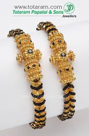 Black And Gold Jewelry 22 Karat Gold Kada With Black Beads 1 Pair Gold Bangles Indian Bangles Jewelry Designs Gold Jewelry Stores
