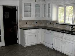 You can't do a dark backsplash with light countertops if you're going for this look consider a lighter, low contrast paint colour on your walls to help transition the impact of the white cabinets, since the countertop/backsplash will visually. White Cabinets And Ceramic Floors Youtube