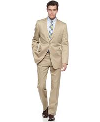 This fun hat is composed of four panels of camel colored suede, brought together at the top of the hat's crown and accented with a singl. Head Into Neutral Territory This Tan Cotton Suit From Lauren By Ralph Lauren Has Sophisticated Quiet Conf Ralph Lauren Suits Slim Fit Suit Men Big Mens Suits