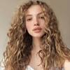 For a subtle approach, choose a deep caramel tone to outline either wavy or curly hair with lowlights. 3