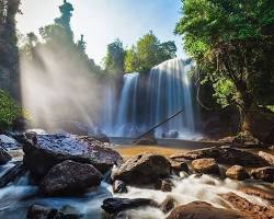 A waterfall cascading over rocks in Kulen Mountains National Park.