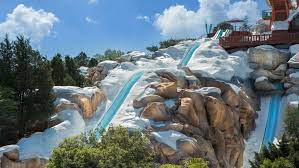 The Snow Banked Waterslide Parallels Summit Plummet At Disney S Blizzard Beach Blizzard Beach Disney Resort Hotels Disney Blizzard Beach