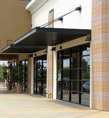 18 Inspirational Examples Of Modern Garage Doors Garage Door Design Entrance Door Design Metal Awning