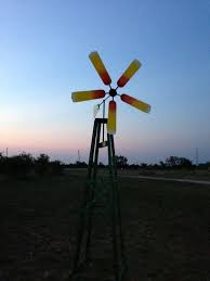 Sunflower Windmill We Made This Out Of Ceiling Fan Blades The Mechanism Out Of A Bike Wheel And Some Random Metal Ceiling Fan Blades Ceiling Fan Windmill Diy