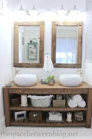 The interesting center cabinet style opens outward to cover the drawers, and can be left that way if you prefer the open shelf look. Rustic Master Bathroom The Space Between Rustic Bathroom Vanities Rustic Master Bathroom Rustic Bathroom