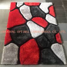 The rug consists of colors with a variation of greens, dark orange, yellow and beige; China Black And Red Shaggy Rug Factory Price Polyester 3d Shaggy Carpet China Shaggy Carpet And 3d Carpet Price