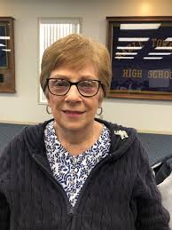 Vice President Barbara Grosso (chair) and President Nancy Mensinger planted  mums and ornamental cabbage at Helping Hands Society's playground.