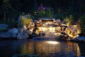 Good Use Of Underwater And Surrounding Lights In A Pond And Water Cascade Ponds Backyard Water Features Waterfalls Backyard