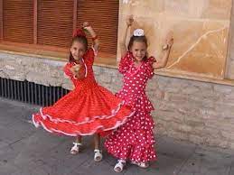I wanted to write you guys about one of the things i like most about being here in spain, how well the people dress here! Spain Clothing Girls In Andalucia In Southern Spain In Traditional Dress With Spain Traditional Dress Traditional Dresses Outfits For Spain