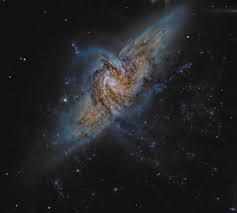 One Galaxy Upright Blocking The View Of Another Larger Galaxy 25 Million Light Years Further Away Than The Other Th Galaxies Space And Astronomy Astronomy