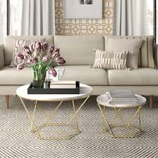Marble coffee tables can be either genuine marble or made from a faux marbleising look so there's something for every budget, and they come in round. Bring Mod Style To Your Ensemble With This Two Piece Set Of Geometric Coffee Tables Crafted Coffee Table Geometric Coffee Table Round Coffee Table Living Room